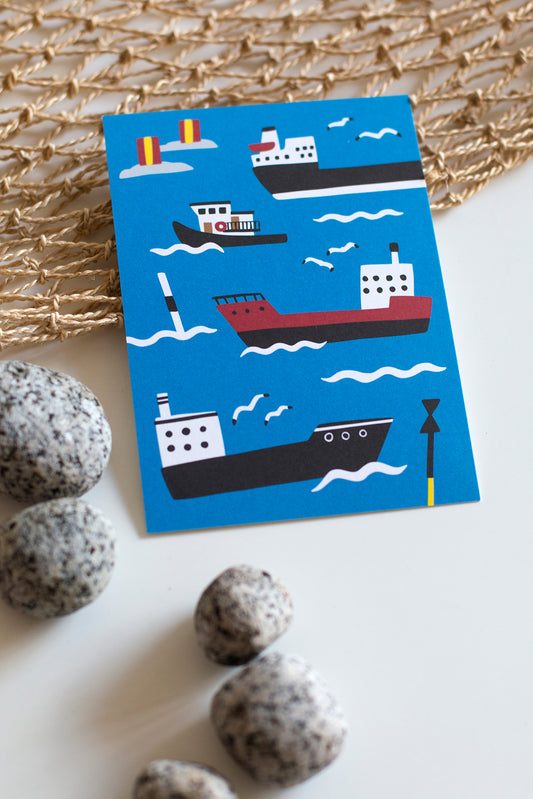 Laivat postcard on a table