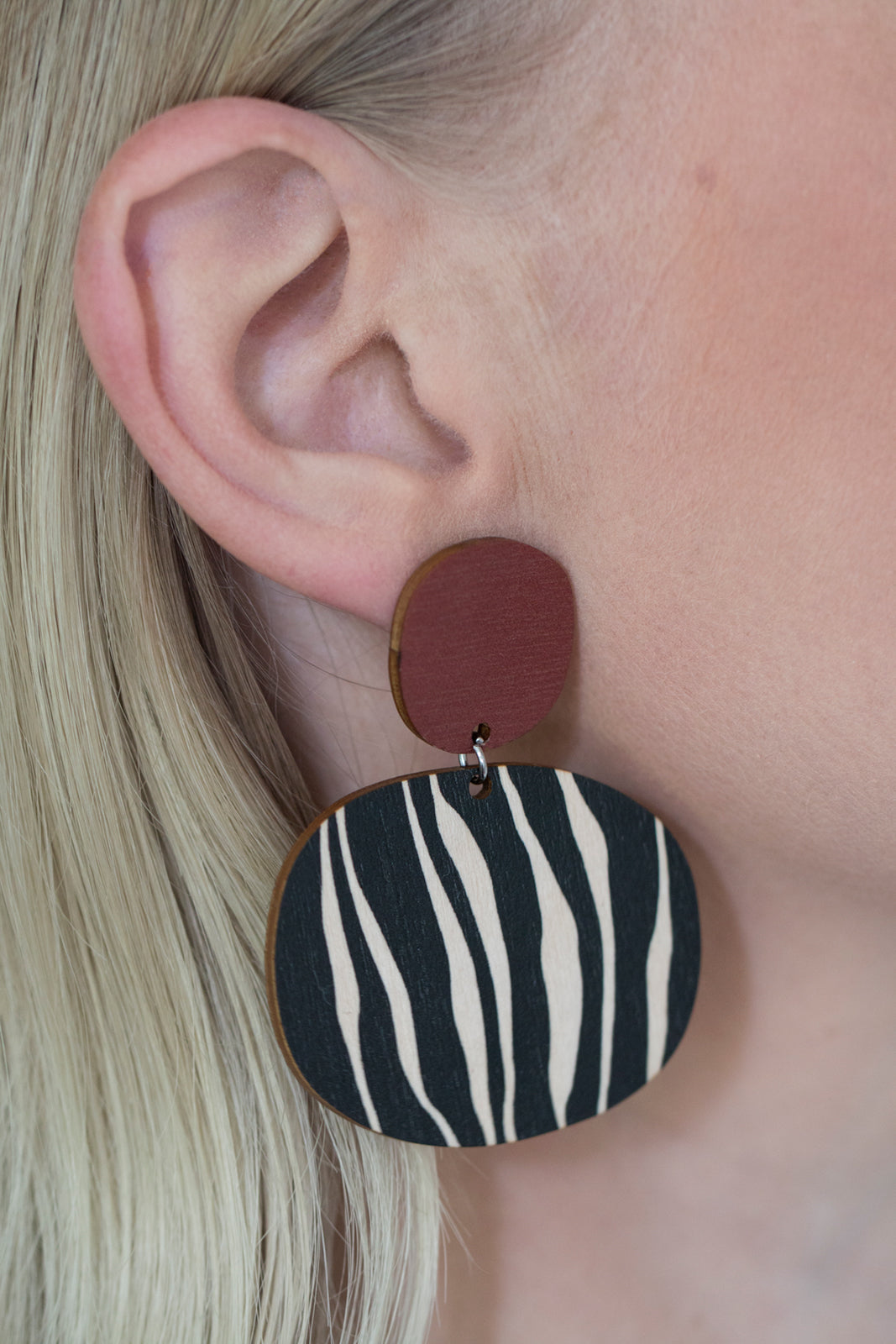Kivi earrings in use, maroon