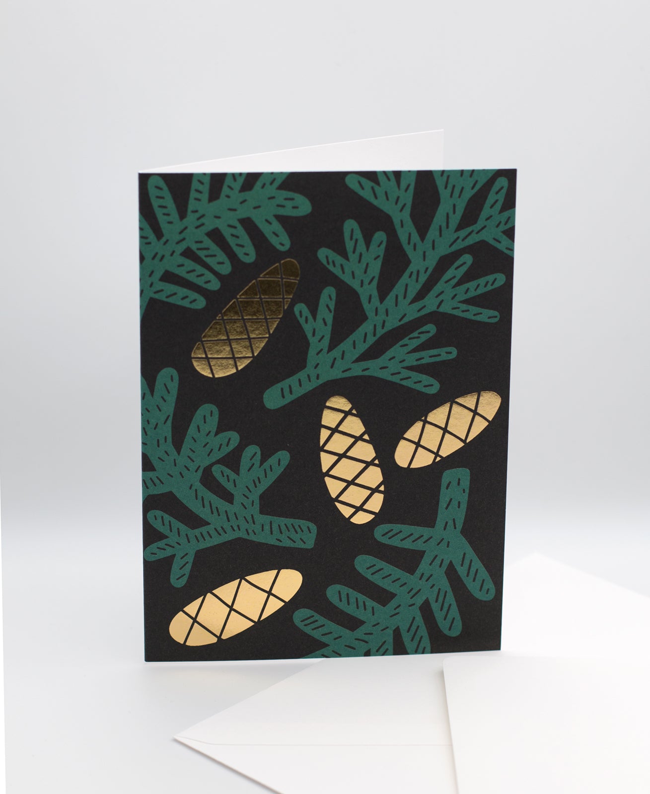 Kävyt greeting card and white envelope